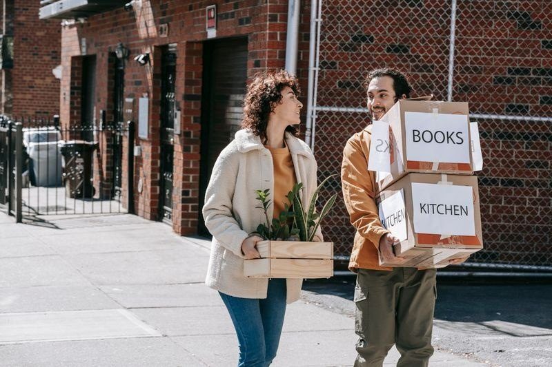 Simpson Brothers Moving movers carrying boxes