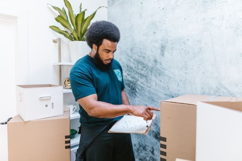 Simpson Brothers Moving mover on the job in Lawrence
