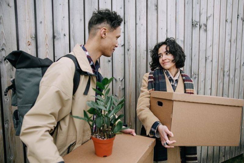 Simpson Brothers Moving movers carrying boxes